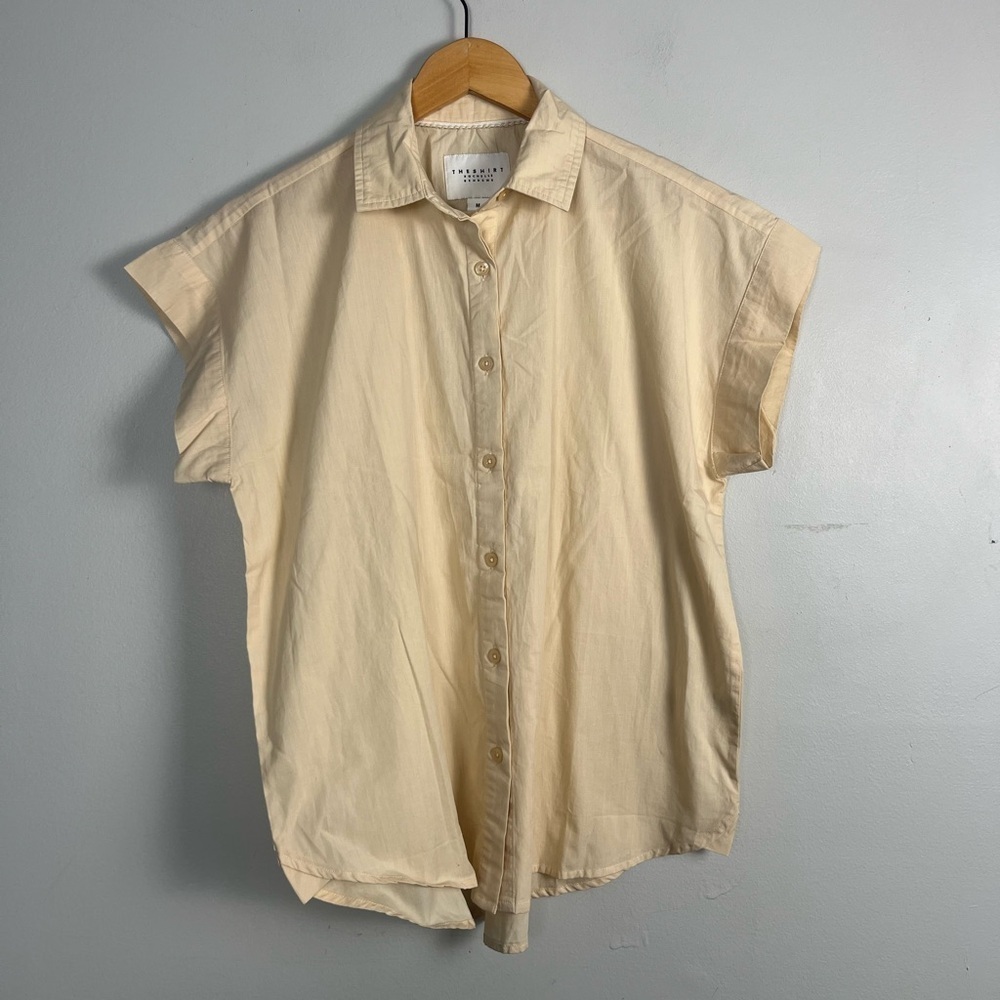 The shirt by Rochelle Behrens cream button down blouse size medium